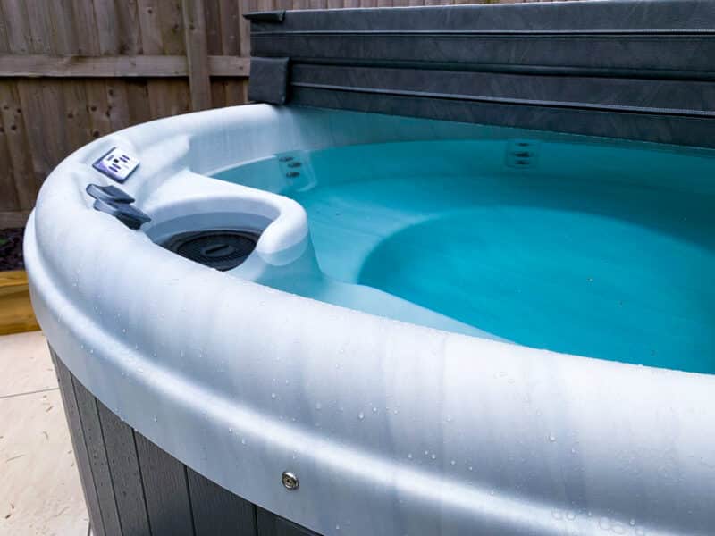 Close-up of Impulse DP round hot tub water jets and controls - premium Balboa hot tub for UK homes